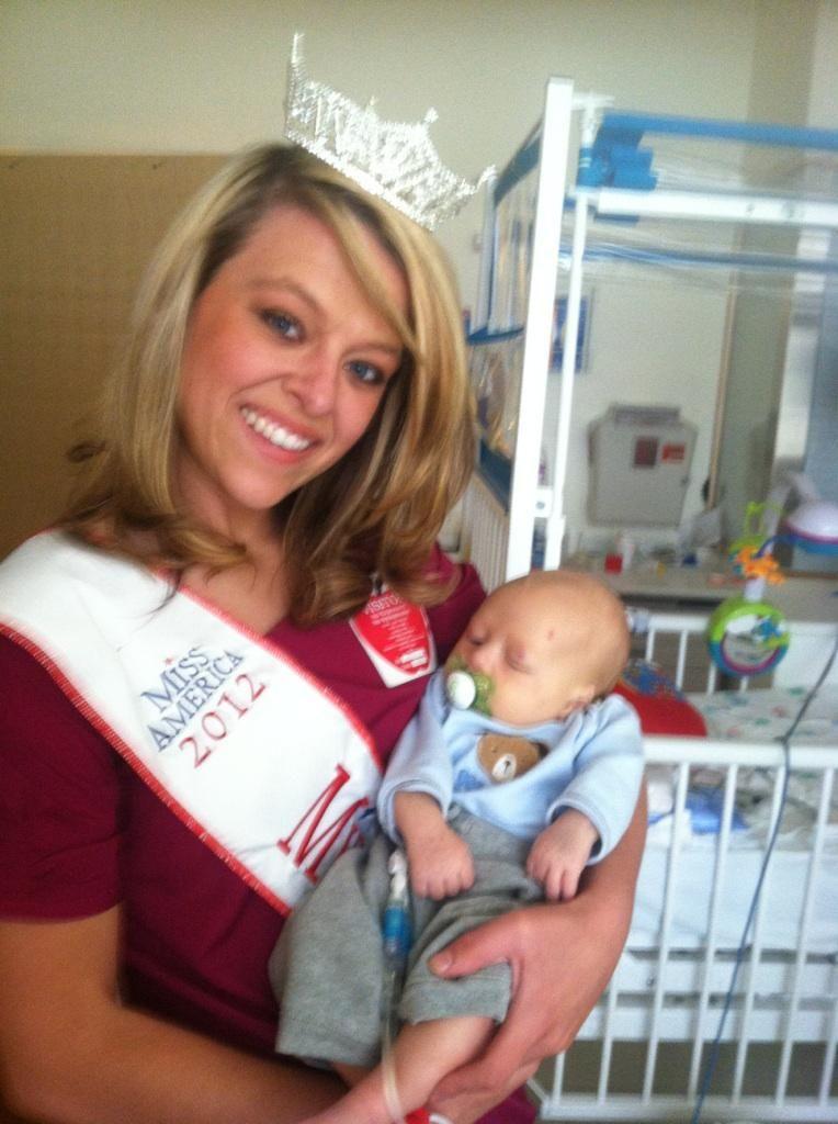 Megan Dimitt holds a baby at the childrens hospital.