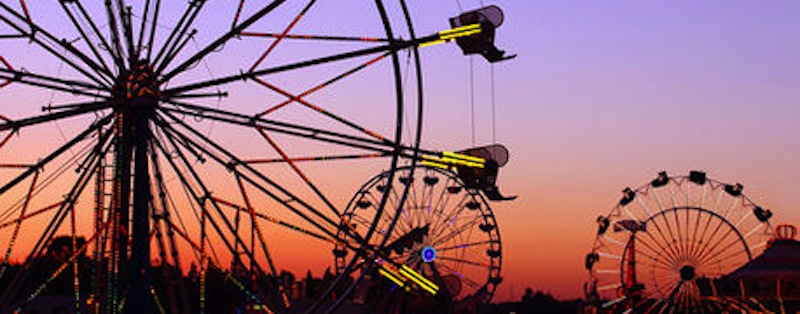 The Nebraska State Fair carnival on the Midway at sunset. 
Photo Curtsey of farmprogress.com. 