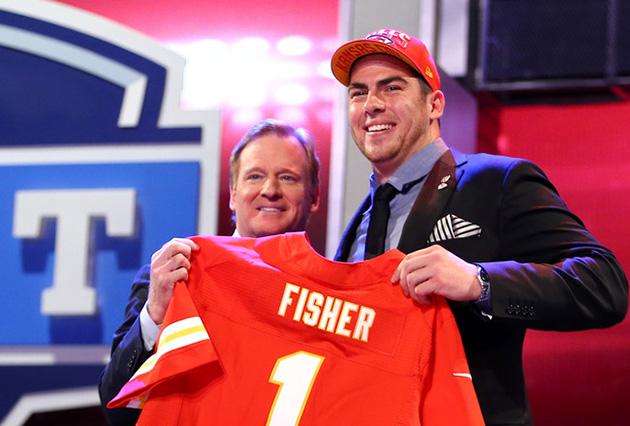Jake+Fisher+of+Central+Michigan+posing+with+Roger+Goodell+after+being+drafted+number+one+overall.+