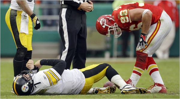 Ben Roethlisberger (ground) after suffering a blow to the head.  