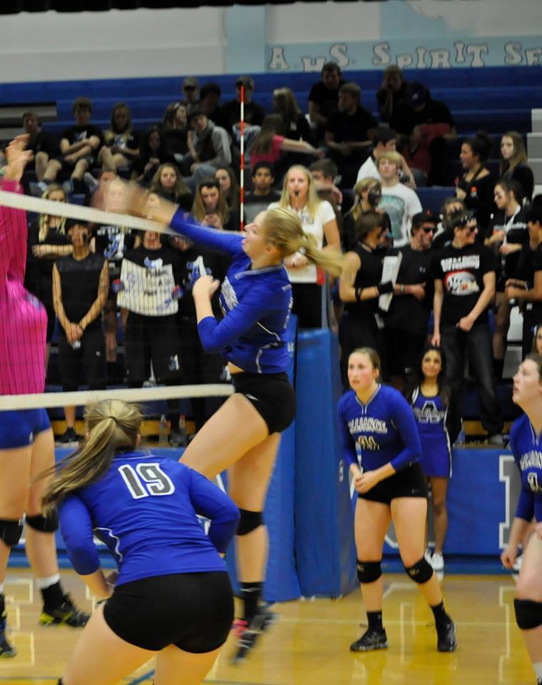 Junior Kennedy Cyza attempts a spike at a competition earlier this year. 