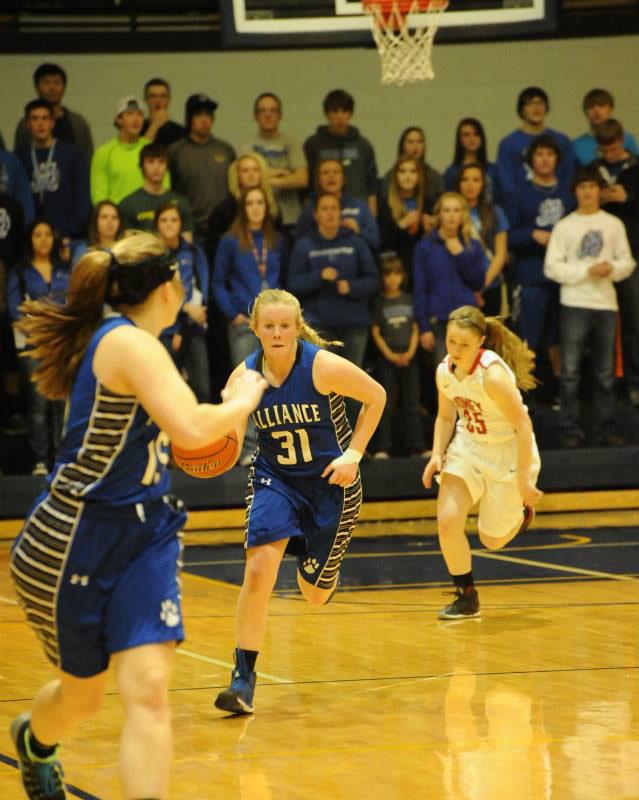 Rylee Trout (31) dribbles up the court as she looks for her teammate Caitlyn Tritle.