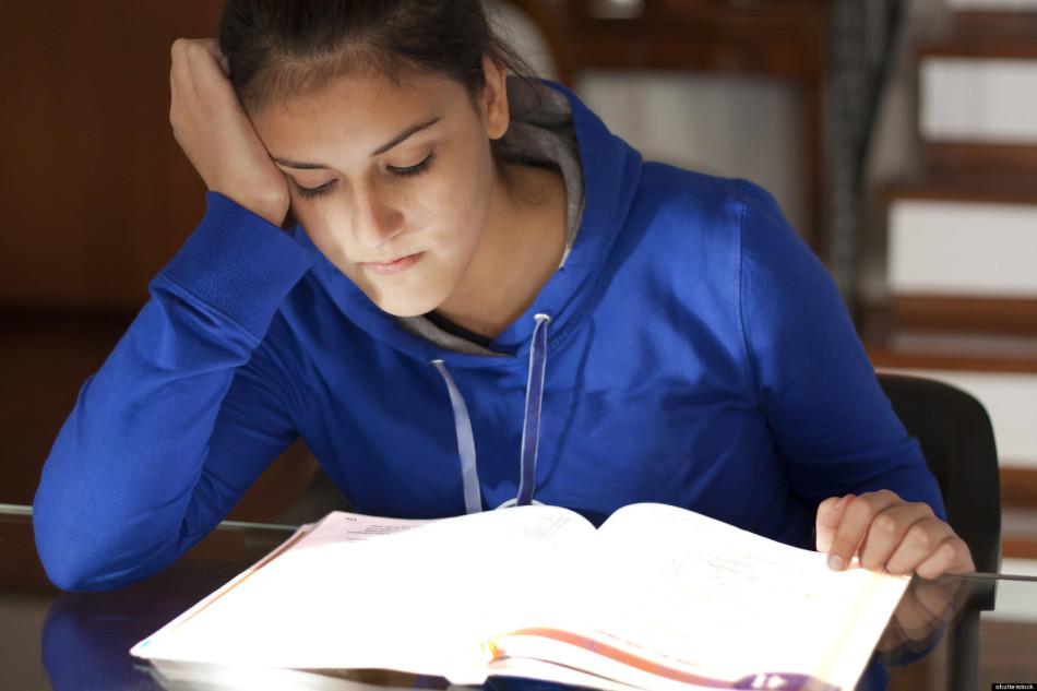 A high school student stressed about her homework.