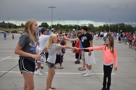 Students participate in the water balloon toss.