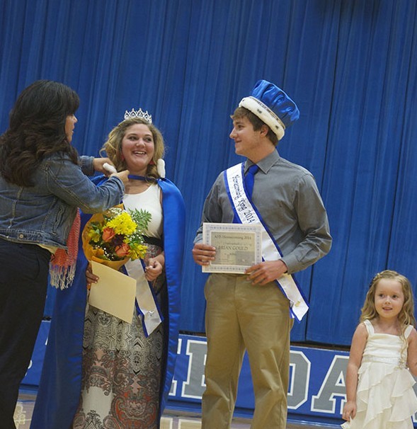 Brian Gould and Christa Horn receive the 2014 Homecoming King and Queen.