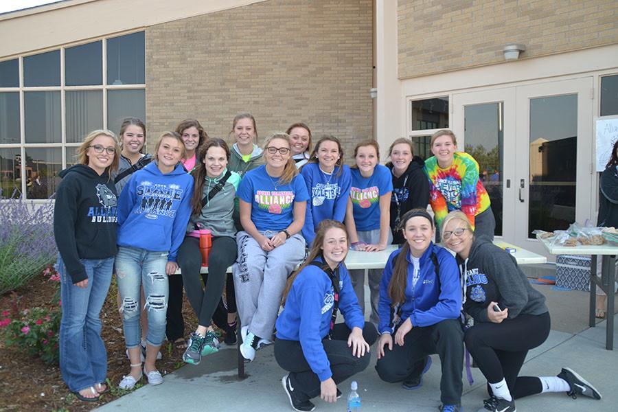 The Alliance Spikers volleyball team working at the Big Blue Barbecue. 