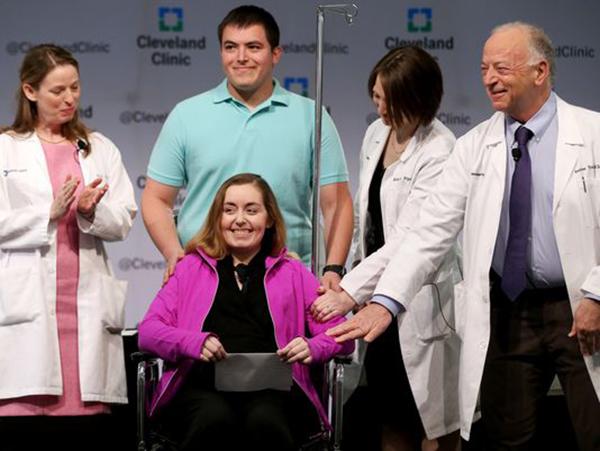 The patient, Lindsey, with her husband and doctors. Photo courtesy of Google Images. 